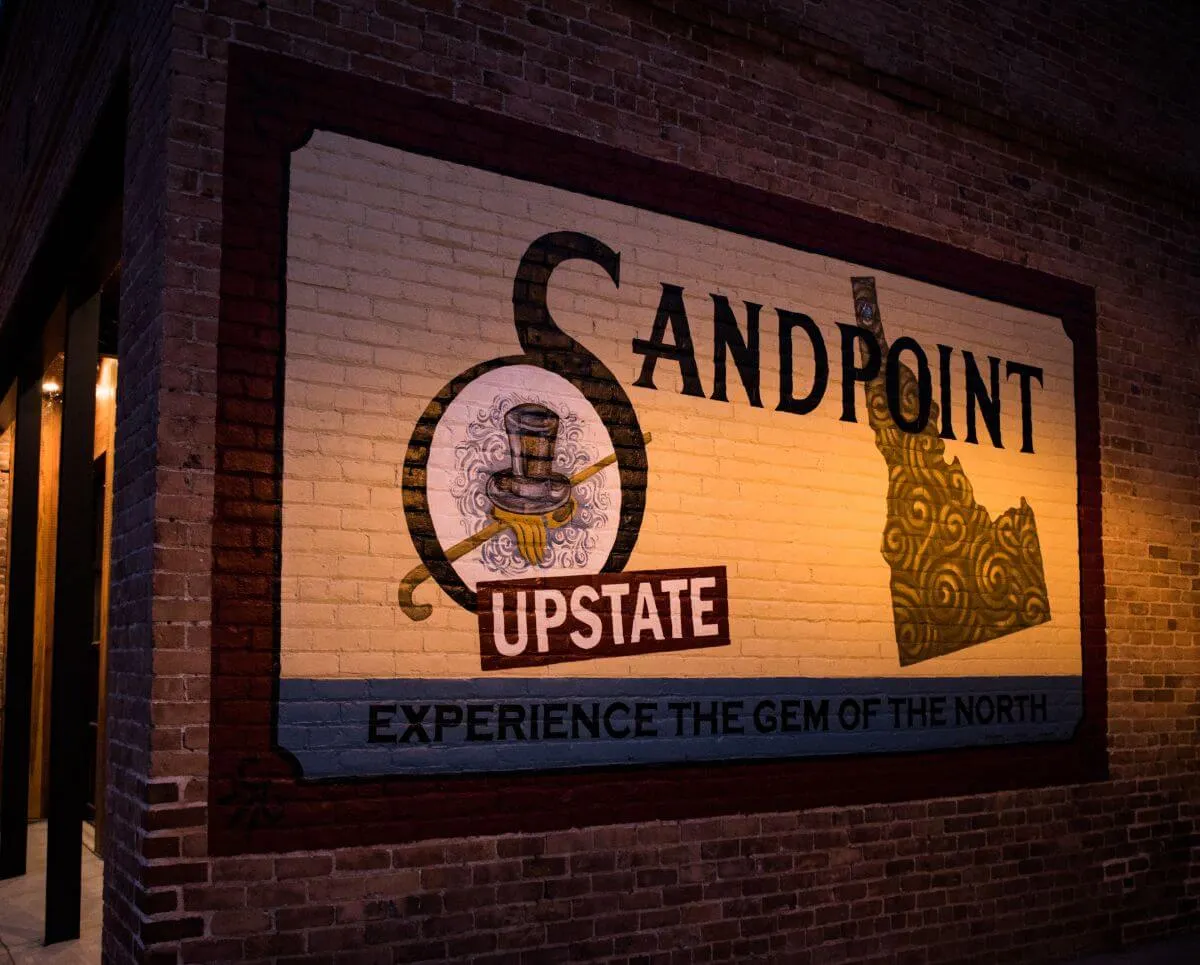 Sign on brick wall of Sandpoint, Idaho