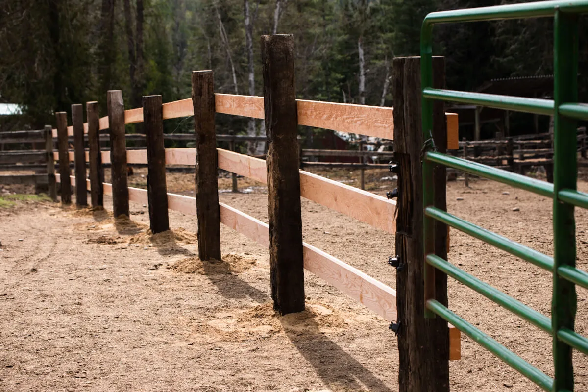 New three rail fence with green gate