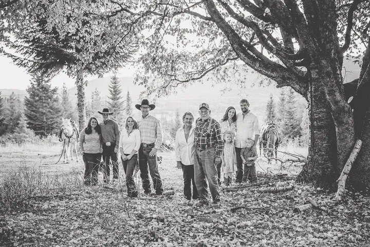Black and white ranch family photo with grandparents, children and grandchildren