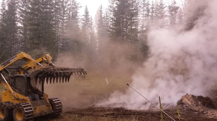 Smoking burned pile