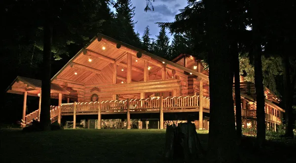 The log lodge lit up at night