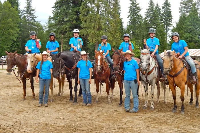 kids on horses lined up in an arena at Western Pleasure Guest Ranch Youth Horsemanship program
