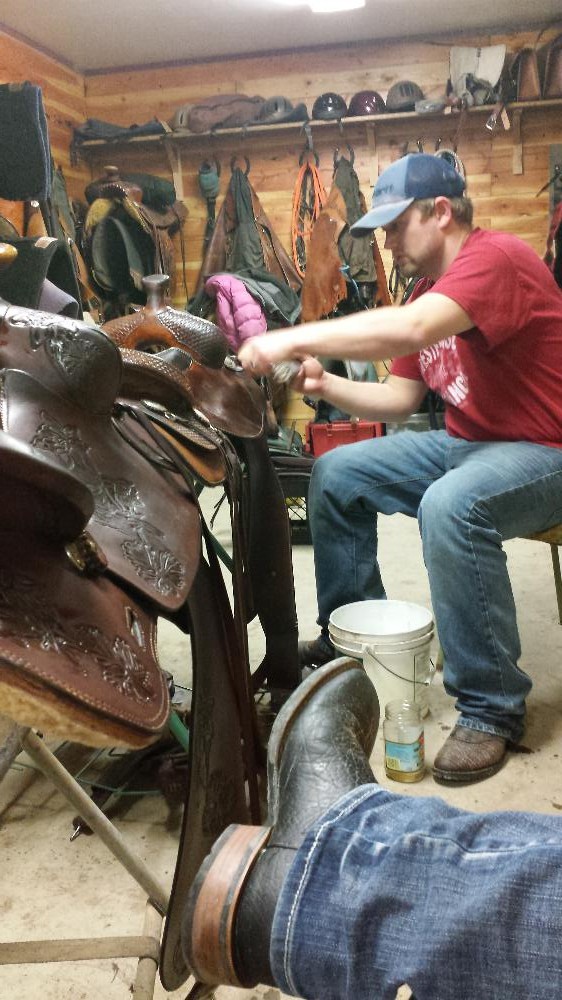 Landon and I cleaning our saddles